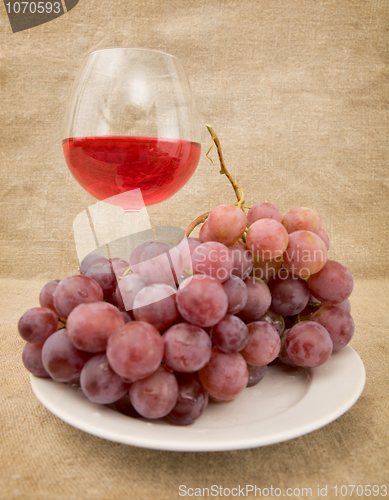 Image of Goblet and grapes
