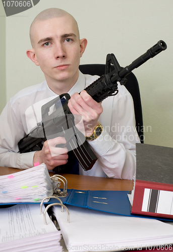 Image of Accountant armed with a rifle