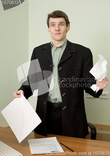 Image of Director on a workplace with a crushed paper