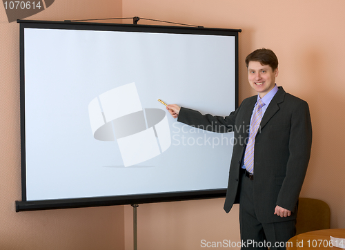 Image of Businessman near the white screen