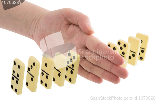 Image of Bones of dominoes and hand