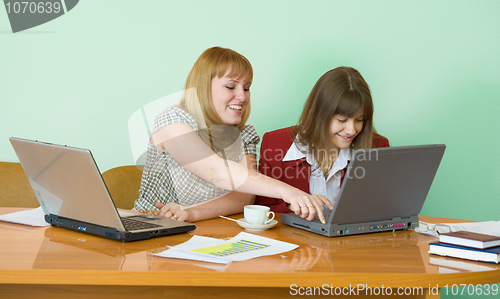 Image of Girls work sitting at a table