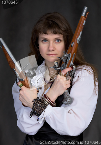 Image of Girl - pirate with two ancient pistols in hands