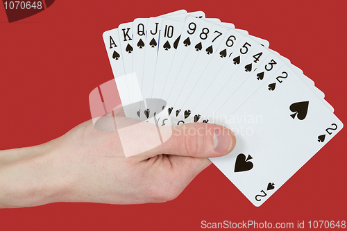 Image of Playing cards on hands