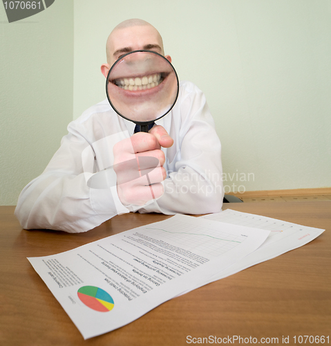 Image of Guy looks through the big magnifier