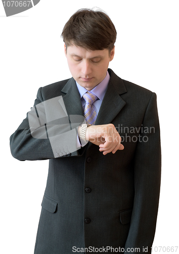 Image of Young man looks at a watch