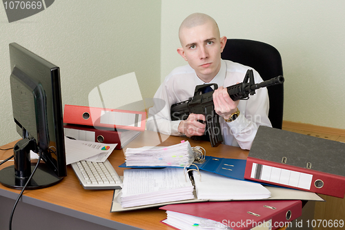 Image of Accountant armed with a rifle