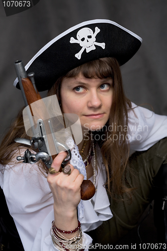 Image of Girl - pirate with pistol in hand