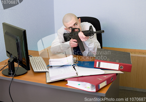 Image of Accountant armed with a rifle