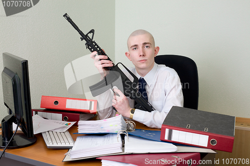 Image of Accountant armed with a rifle