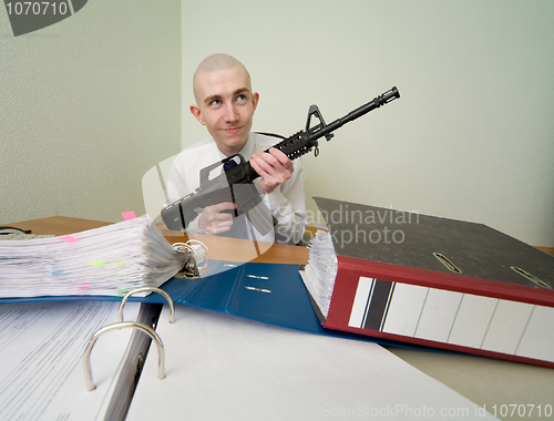 Image of Accountant armed with a rifle