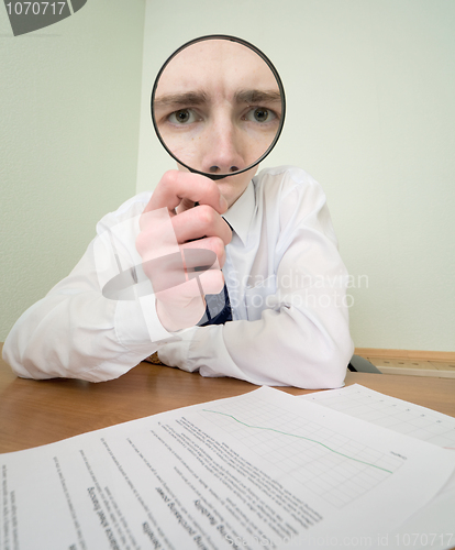Image of Guy looks through the magnifier