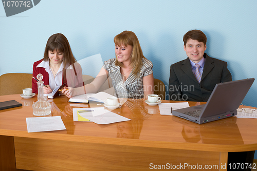 Image of Business team sits at the table