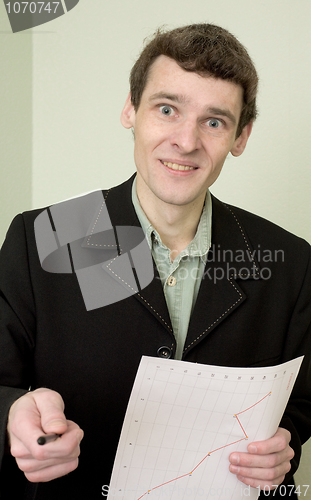 Image of Director on a workplace with a graph
