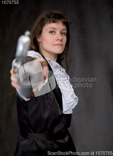 Image of The girl - pirate with ancient pistol in hand