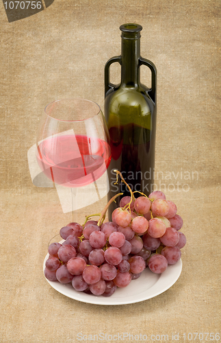 Image of Bottle, gapes and goblet