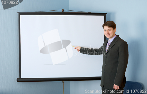 Image of Businessman near the white screen