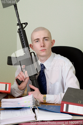 Image of Accountant armed with a rifle