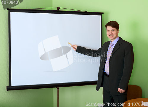 Image of Businessman near the white screen