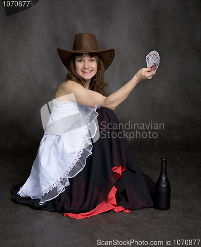 Image of Girl with a playing-cards in hand