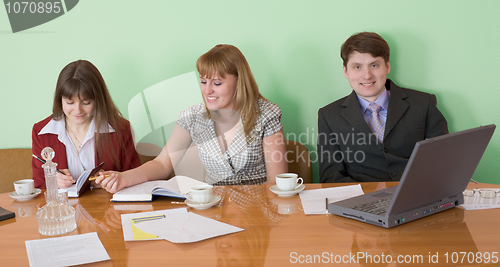 Image of Business team sits at the table