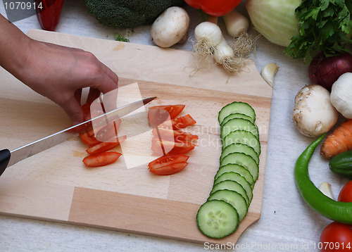 Image of Hand cutting vegetables