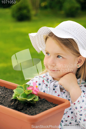 Image of Little girl   gardening
