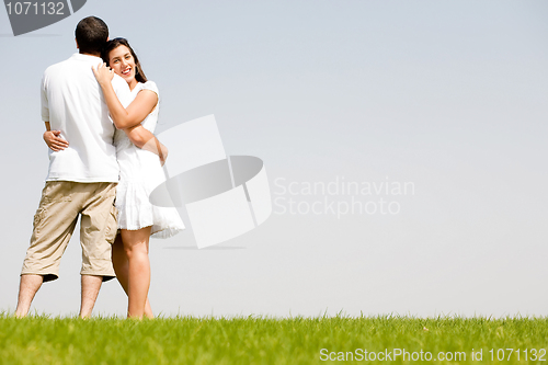 Image of young couple hug