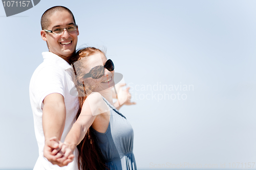 Image of love couple Stretching Their Hands Together