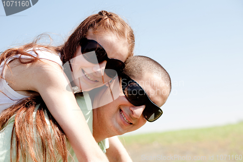 Image of young Couple Piggybacking