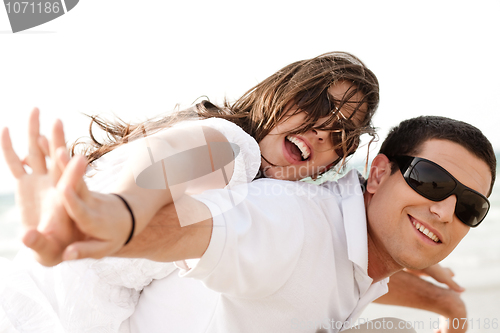 Image of Young Couple Piggybacking
