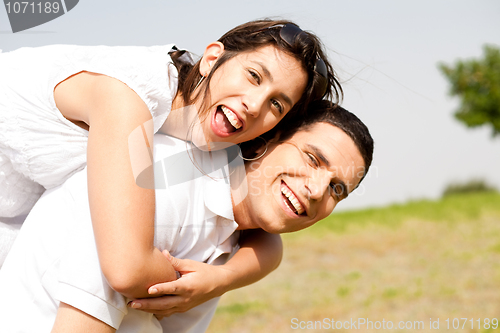 Image of young Couple Piggybacking