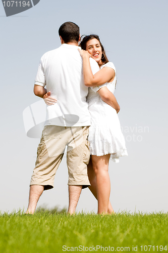 Image of young couple hug