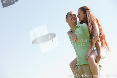 Image of Man Piggybacking His Girlfriend