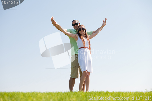 Image of Couple Stretching Their Hands Together