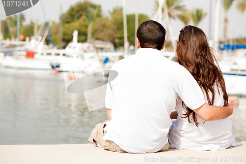 Image of Young Couple Seated On A Footbridge