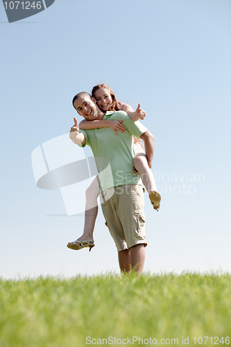 Image of Man Piggybacking His Girlfriend