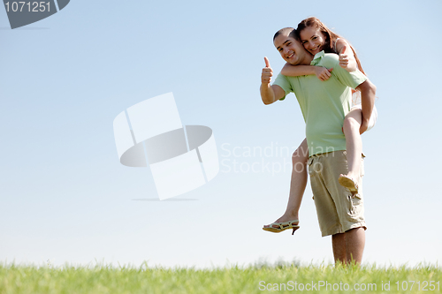 Image of Man Piggybacking His Girlfriend