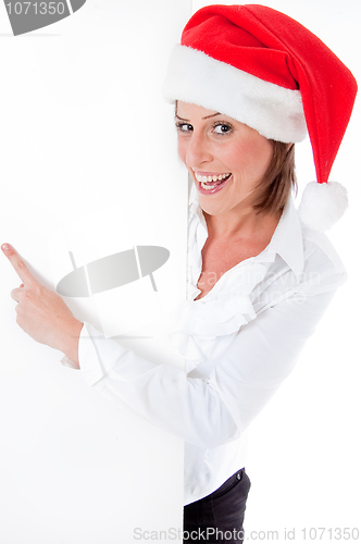 Image of Female Santa pointing down at blank billboard