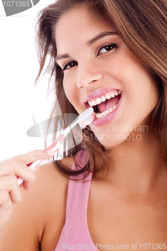 Image of cute girl brusing her teeh