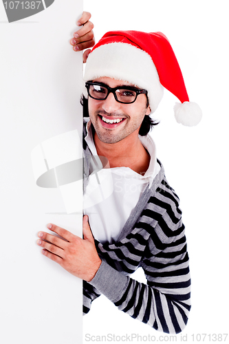 Image of handsome man wearing santa's hat