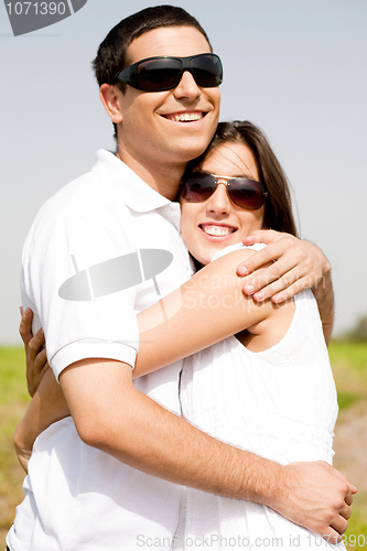 Image of Portrait of Romantic couple hugging passionately