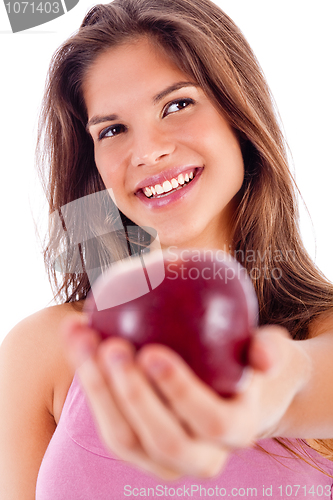 Image of portrait of happy girl showing red apple