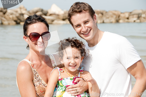 Image of Family of three on the beach