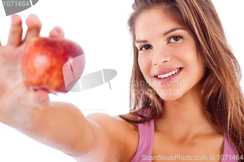 Image of portrait of happy girl showing red apple