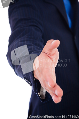 Image of business man welcoming you with an open hand ready to shake