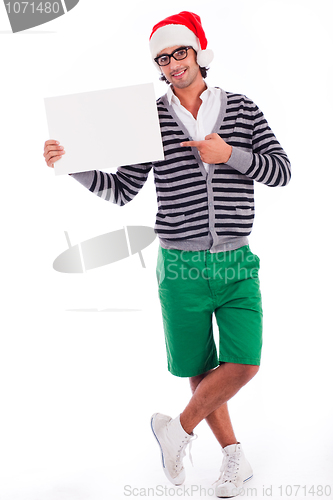 Image of playful santa boy with a blank board