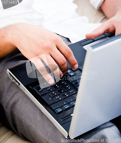 Image of isolated grey open laptop man typing