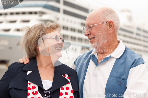 Image of Senior Couple On Shore in Front of Cruise Ship