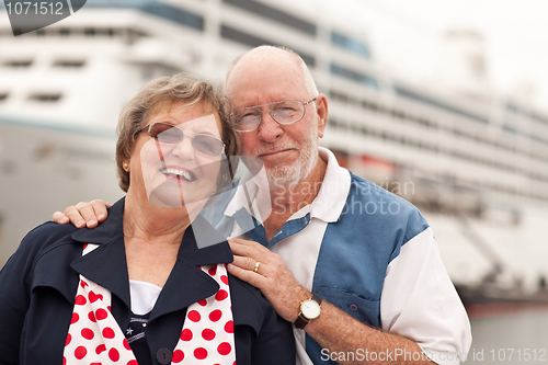 Image of Senior Couple On Shore in Front of Cruise Ship